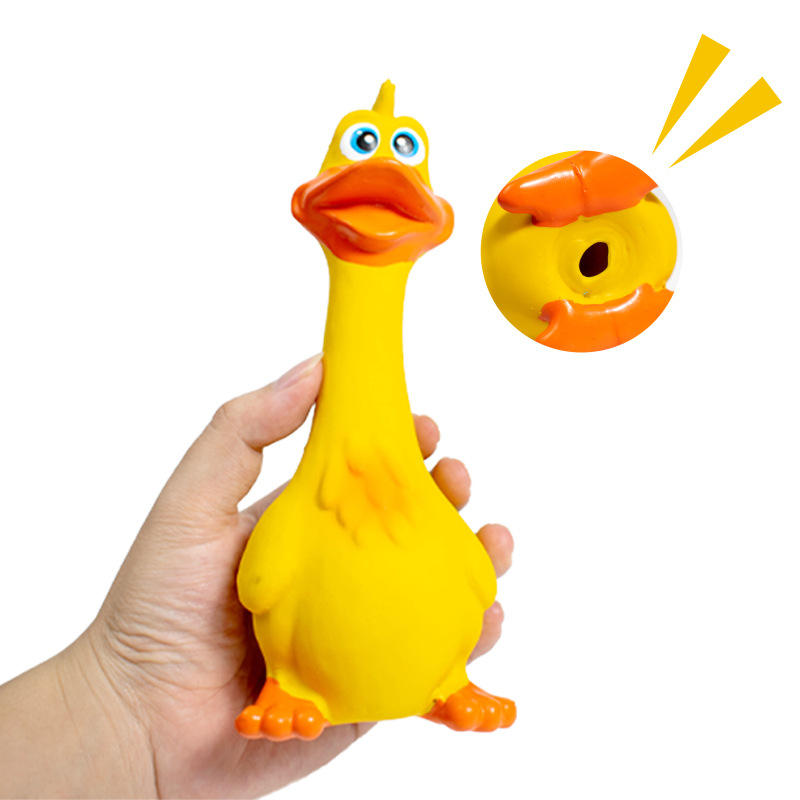Funny yellow chicken-shaped dog toy with a playful face and bright pink accents.